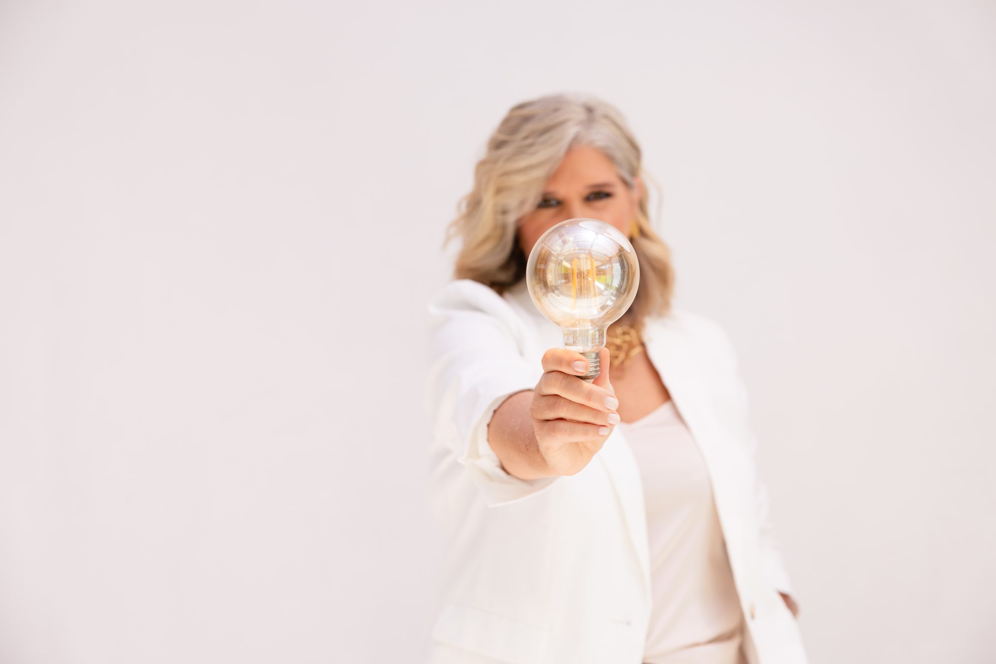 Clarity — holding a single lightbulb